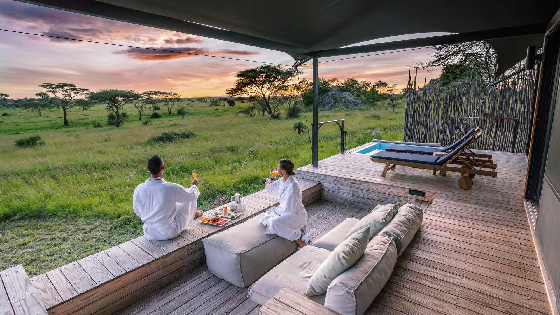 Sunset breakfast at a luxury tented camp overlooking the plains